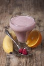 Smoothie of banana, orange juice , frozen raspberry with yogur Royalty Free Stock Photo