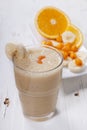 Smoothie of banana, orange juice , frozen sea-buckthorn with y Royalty Free Stock Photo