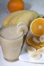 Smoothie of banana, orange juice , frozen sea-buckthorn with y Royalty Free Stock Photo