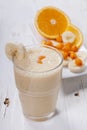 Smoothie of banana, orange juice , frozen sea-buckthorn with y Royalty Free Stock Photo