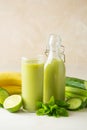 Smoothie with banana, spinach and lime. Healthy detox green drink glass Royalty Free Stock Photo