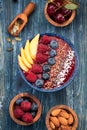 Smoothie with berries and fruit, flax and chia seeds in a bowl, top view Royalty Free Stock Photo