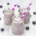 Smoothie with blueberry, banana, oats, almond milk and yogurt, square format