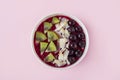Smoothie bowl with acai, banana, blueberries, kiwi fruit and black currants. Healthy super food with fresh fruit. Vegetarian and Royalty Free Stock Photo