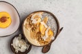 Smoothie bowl with chia pudding, peach, coconut and granola in a