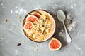 Smoothie bowl with figs, peanut butter and muesli. Royalty Free Stock Photo