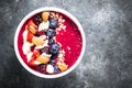 Smoothie bowl from fresh berries, nuts and granola. Royalty Free Stock Photo