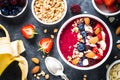 Smoothie bowl from fresh berries, nuts and granola. Royalty Free Stock Photo