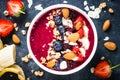 Smoothie bowl from fresh berries, nuts and granola. Royalty Free Stock Photo