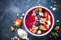 Smoothie bowl from fresh berries, nuts and granola. Royalty Free Stock Photo