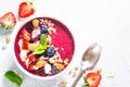 Smoothie bowl from fresh berries, nuts and granola. Royalty Free Stock Photo