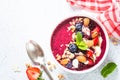 Smoothie bowl from fresh berries, nuts and granola. Royalty Free Stock Photo