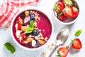 Smoothie bowl from fresh berries, nuts and granola. Royalty Free Stock Photo