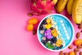 Smoothie bowl with fruits, berries, nuts and flowers. Tropical healthy smoothie dessert. Healthy breakfast, vegetarian, dieting Royalty Free Stock Photo