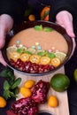 Smoothie bowl garnished with kumquats, pomegranate, lime and mint Royalty Free Stock Photo