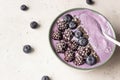 Smoothie bowl topped with blueberries, blackberries, chia seeds and coconut flakes. Royalty Free Stock Photo