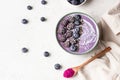 Smoothie bowl topped with blueberries, blackberries, chia seeds and coconut flakes. Royalty Free Stock Photo