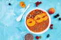 Smoothie bowls. Healthy breakfast bowl on blue background.