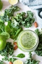 Smoothie detox with green fruits, vegetables, spinach and kale on white