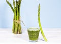 Smoothie of Fresh Green Asparagus on Table. Equilibrium floating food. Healthy Alkaline diet. Balance. Copy Space. Vegetarianism. Royalty Free Stock Photo