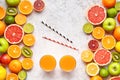 Smoothie or fresh juice vitamin drink in citrus fruits background flat lay, helthy vegetarian organic antioxidant detox Royalty Free Stock Photo