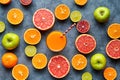 Smoothie or fresh juice vitamin drink in sliced citrus fruits background flat lay