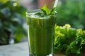 Smoothie garnished with mint on natural background