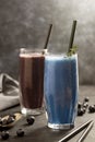 Smoothie glasses with spirulina powder. Fresh banana, blueberry healthy detox drinks