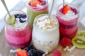 Smoothie jars with bright layers of fruit purÃÂ©e, oats, and coconut flakes Royalty Free Stock Photo
