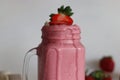 Smoothie made of fresh strawberries, banana and almond milk Royalty Free Stock Photo