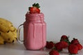 Smoothie made of fresh strawberries, banana and almond milk Royalty Free Stock Photo