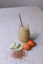 Smoothie made with peach, zucchini with white background Royalty Free Stock Photo