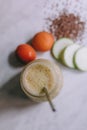 Smoothie made with peach, zucchini with white background Royalty Free Stock Photo