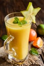 Smoothie with mandarins, carambola and lime