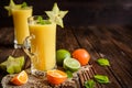 Smoothie with mandarins, carambola and lime