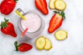 Smoothie or milkshake cocktail made from fresh strawberries, banana, yogurt or milk and ice cubes Royalty Free Stock Photo