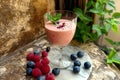 Smoothie with raspberry, blueberry and mint in a glass Royalty Free Stock Photo
