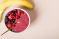 Smoothie surrounded by bananas, strawberries, and blueberries Royalty Free Stock Photo