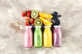 Smoothie variation. Healthy lifestyle concept. several bottles with fruit and berry juices smoothies or milkshakes