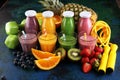 Smoothie variation. Healthy lifestyle concept. sport fitness equipment-several bottles with fruit and berry juices smoothies or