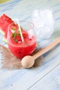 Smoothie from water melon on burlap with wooden pestle Royalty Free Stock Photo