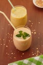 Smoothies banana - orange and banana - kiwi Royalty Free Stock Photo