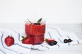 Smoothies of black currant and strawberries with yogurt on a white wooden table Royalty Free Stock Photo
