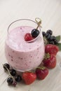 Smoothies of black currants and strawberries . Royalty Free Stock Photo