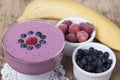 Smoothies of frozen strawberries , blueberries and banana with y Royalty Free Stock Photo