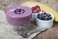 Smoothies of frozen strawberries , blueberries and banana with y Royalty Free Stock Photo