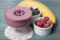 Smoothies of frozen strawberries , blueberries and banana with y Royalty Free Stock Photo