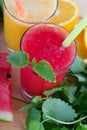 Smoothies from orange and tangerine and smoothie from watermelon Royalty Free Stock Photo