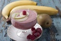 Smoothies of pear, banana and frozen raspberries with yogurt. Royalty Free Stock Photo