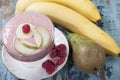 Smoothies of pear, banana and frozen raspberries with yogurt. Royalty Free Stock Photo